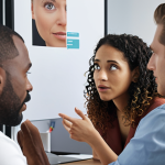 **

A diverse team collaborating in a modern office space. Focus on active listening: one person speaking while others are attentively engaged with empathetic expressions. Include visual cues of understanding like nodding and eye contact. The overall tone should be positive and collaborative.

**